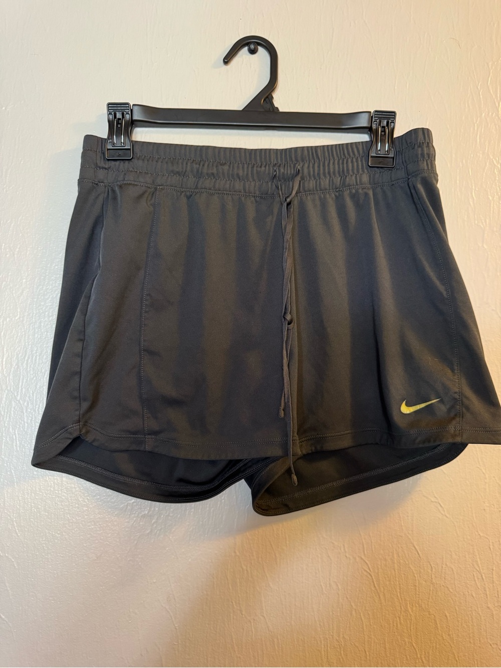Nike Women's Black Athletic Shorts with Yellow Logo